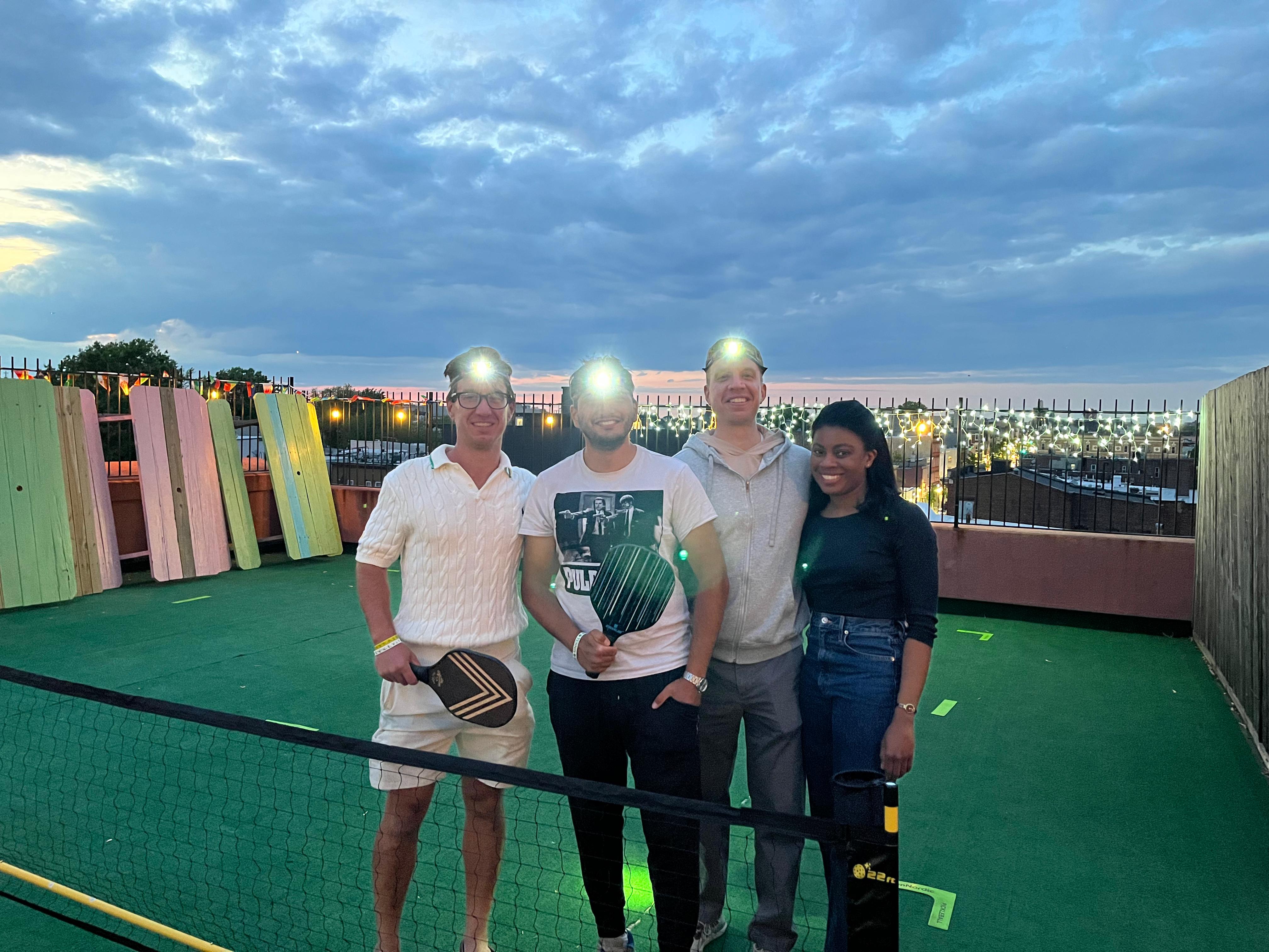 Mixed doubles players socializing at a league event