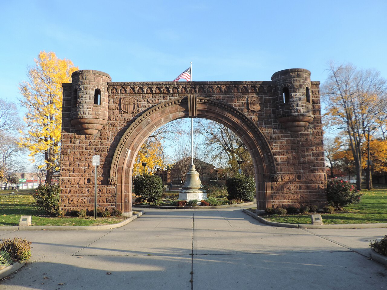 The Pershing Field Park entrance in Jersey City Heights, with the park's stone gateway and green lawns